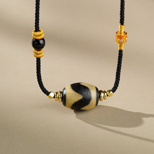 tibetan-buddhist · Yuan Tiger Tooth Dzi Agate Pendant – Handmade Spiritual Necklace