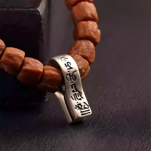 Tibetan Buddhist Jewelry Culture handmade six-syllable mantra clip in pure silver, a sacred piece of Jewelry art for mala beads.