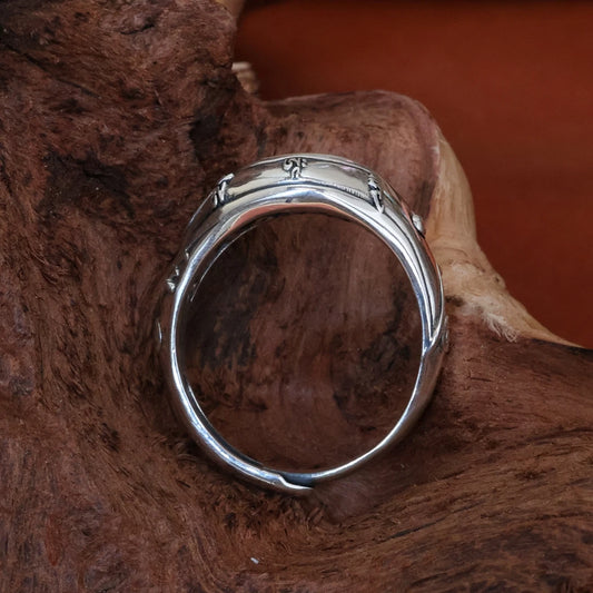 Intricate hand-carved Wisdom Eye ring, showcasing artisan jewelry art inspired by Tibetan Buddhist Jewelry Culture.