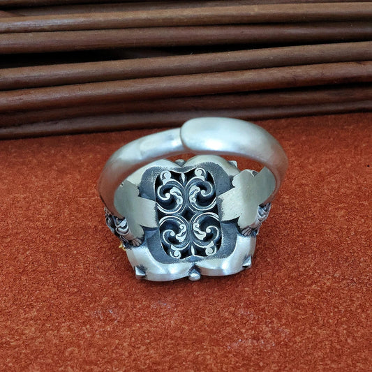 Intricate hand-carved sacred cosmos ring, showcasing artisan jewelry art inspired by Tibetan Buddhist Jewelry Culture.