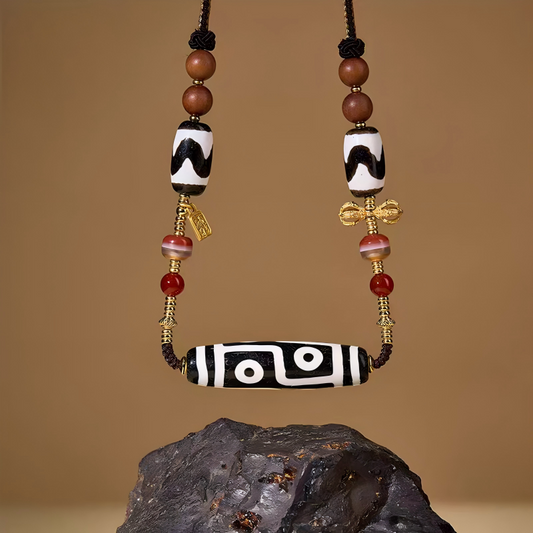 Tibetan Buddhist Jewelry Culture black and white six-eyed Dzi bead agate clavicle necklace. A sacred piece of jewelry art for protection.