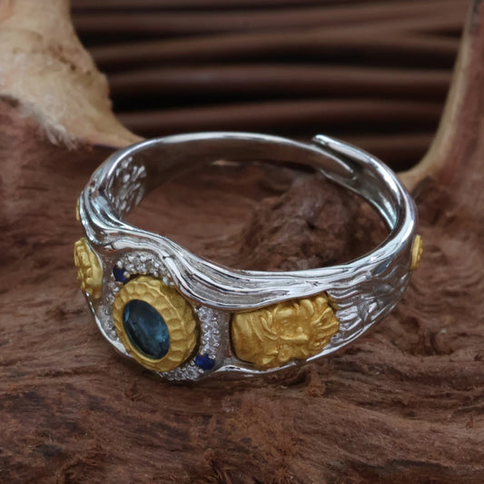 Hand-carved bright silver wealth deity ring, showcasing artisan jewelry art inspired by Tibetan Buddhist Jewelry Culture.