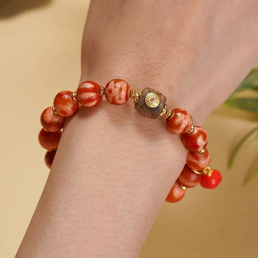Handcrafted Tibetan Buddhist Red Meat Darlo Multi-Treasure Dzi bracelet, promoting spiritual protection, wealth, and exquisite jewelry art craftsmanship.