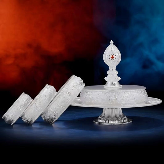 Intricate hand-carved silver Manza plate for sacred offerings, showcasing artisan jewelry art inspired by the traditions of Tibetan Buddhist Jewelry Culture.