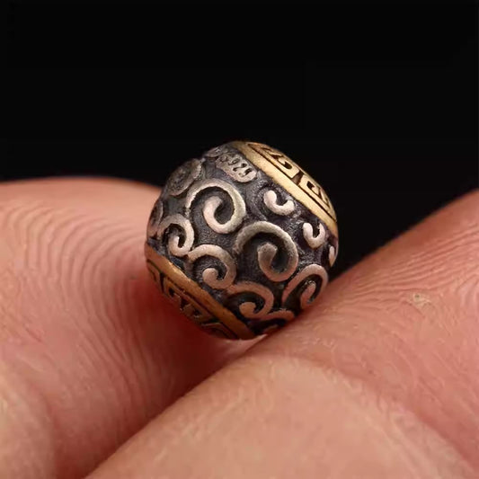 Sterling silver inlaid copper round spacer for Buddhist mala, showcasing artisan craftsmanship in Tibetan Buddhist Jewelry Culture jewelry art.