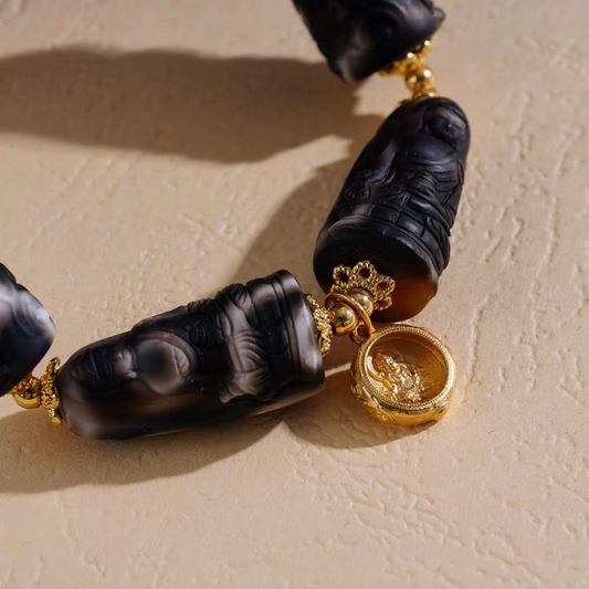 Handcrafted Tibetan Buddhist Medicine F Carved Dzi bracelet, offering spiritual protection, luck, and exquisite jewelry art craftsmanship.