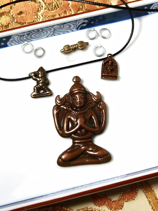 Alt text: This Lima copper statue blends Manjusri Buddha's wisdom with a four-armed Guanyin, symbolizing speech and wisdom. Handcrafted with intricate detailing, this piece reflects Tibetan Buddhist spiritual values.