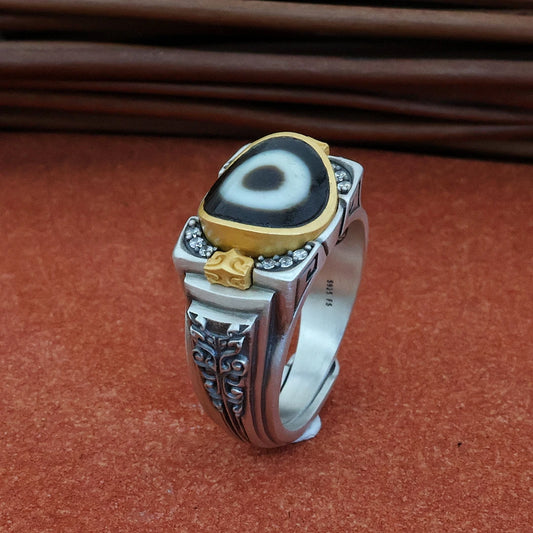 Intricate hand-carved ancient totem ring, showcasing artisan jewelry art inspired by Tibetan Buddhist Jewelry Culture.