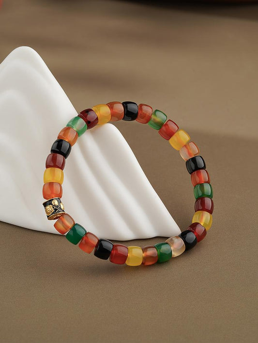 Tibetan Buddhist Jewelry Art: Hand-Painted Dark Agate Wealth Deity (Jambhala) Bracelet for prosperity and abundance in spiritual practice.