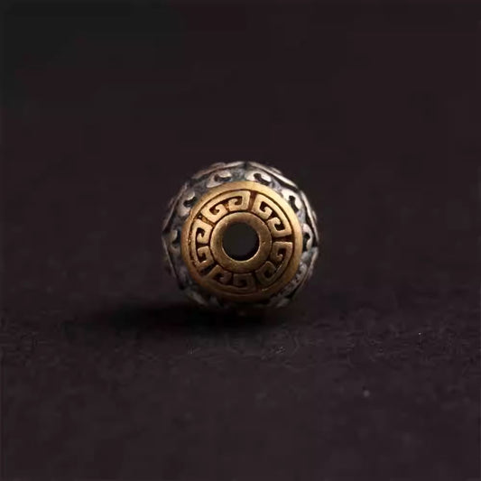 Handmade silver inlaid copper Hui-pattern round spacer bead, showcasing Tibetan Buddhist Jewelry Culture and jewelry art.