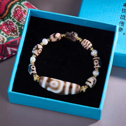 Handcrafted Tibetan Buddhist cow horn Dzi beads bracelet, a unique jewelry art piece for spiritual protection and positive energy.