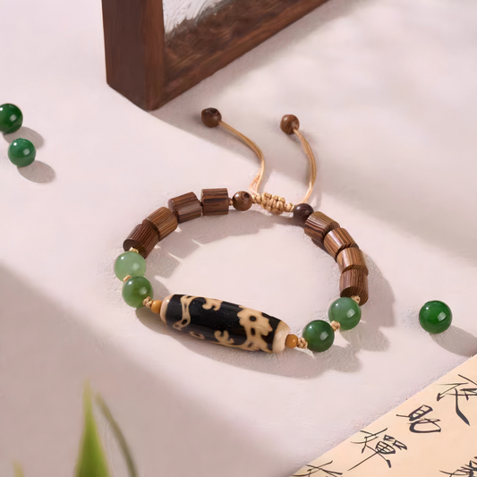 Handcrafted Dragon-riding Guanyin Dzi bead agate bracelet, inspired by Tibetan Buddhist Jewelry Culture, a spiritual jewelry art piece for luck and protection.