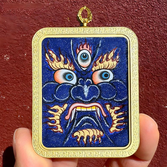 Hand-painted Tibetan Buddhist Five Wealth Gods pendant with yellow, black, red, green, and white faces, showcasing exquisite craftsmanship and spiritual blessings.