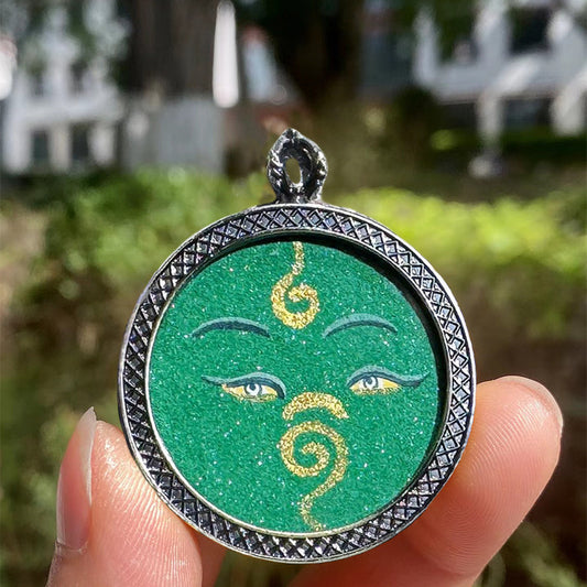 Hand-painted Tibetan Buddhist pendant featuring Green Tara, small Thangka inside Gau box, crafted as jewelry art with spiritual blessings.