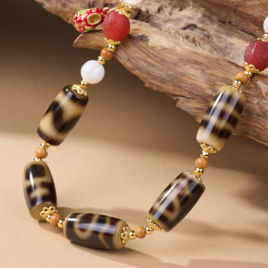 Tibetan Buddhist Jewelry Culture ivory yellow multi-totem Dzi bead clavicle necklace. A sacred piece of jewelry art in natural aged agate.
