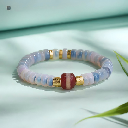 Handcrafted Tibetan Buddhist Red Line Medicine Beads Blue Pop Dzi bracelet, promoting wealth, spiritual protection, and exquisite jewelry art craftsmanship.