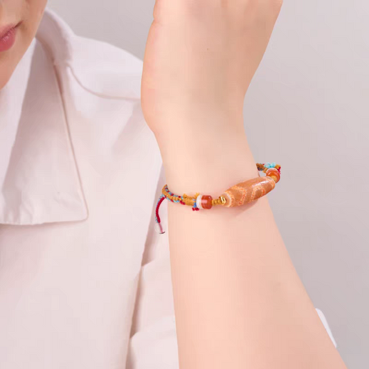 Handcrafted Tibetan Buddhist red mutton Dragon Scale Phoenix Blood Dzi beads bracelet, natural gemstones for luck, protection, and positive energy.