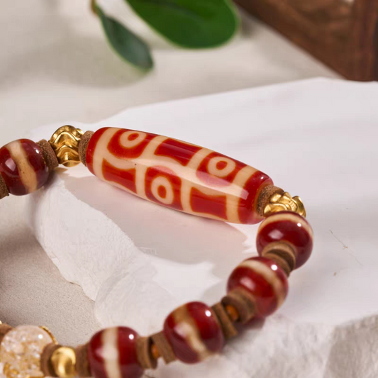 Handcrafted Tibetan Buddhist red mutton Shrisong six-eye Dzi beads bracelet, made with natural gemstones to attract luck, protection, and positive energy.