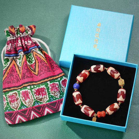 Handcrafted Tibetan Buddhist red mutton tiger fang Dzi beads bracelet, made with natural gemstones to attract luck, protection, and positive energy.