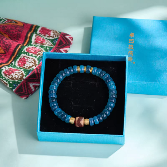 Handcrafted Tibetan Buddhist red mutton tiger fang blue bubble Dzi beads bracelet, natural gemstones attracting luck, protection, and positive energy for men and women.
