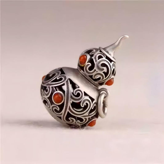 Silver hollow gourd keychain pendant inspired by Tibetan Buddhist Jewelry Culture, handcrafted Jewelry art for stylish men and women.