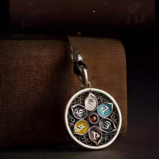 Handcrafted silver lotus pendant with six-syllable mantra, small round design, vintage Tibetan style, perfect for necklaces, symbolizing peace and protection.