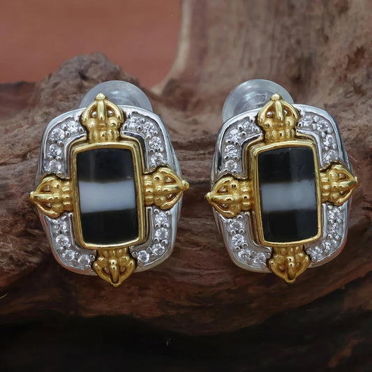 Handcrafted silver earrings featuring Medicine Buddha, Vajra Cross design, symbolizing spiritual healing, protection, and Tibetan Buddhist culture.