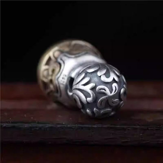 Handcrafted Tibetan silver stamp bead for DIY bracelets, featuring star and moon motifs with spiritual and protective symbolism.