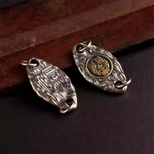 Handmade Tibetan silver mini snail bead clip, perfect for connecting Buddha beads on bracelets, featuring spiritual Vajra and Moon motifs.