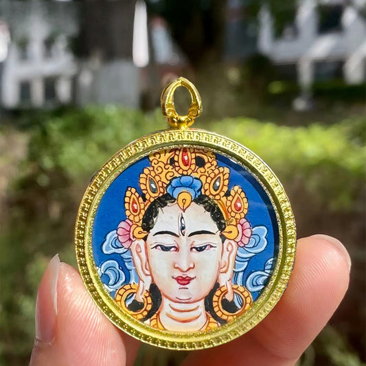 Hand-painted Tibetan Buddhist White Tara pendant with small Thangka in Gau box, handcrafted jewelry art offering protection, compassion, and spiritual blessings.
