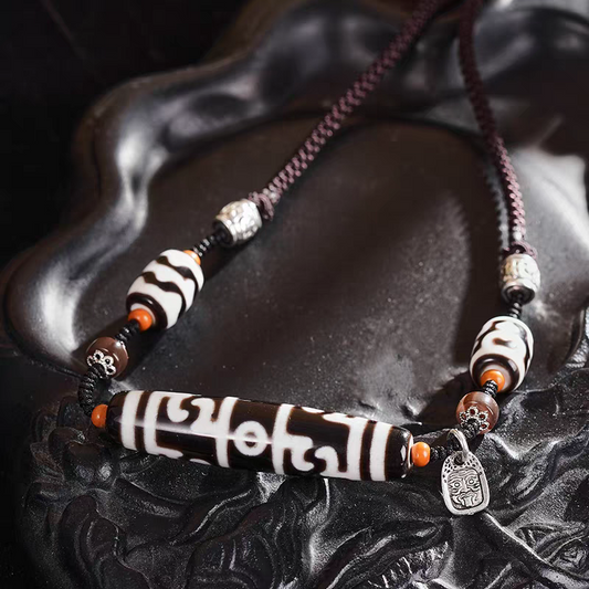 Tibetan Buddhist Jewelry Culture pure black and white Lotus Guru Dzi necklace with ritual implements totems. A masterpiece of jewelry art in natural agate.