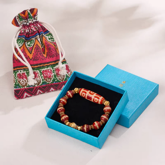 Tibetan Buddhist handmade red mutton six-eye Dzi bead bracelet, unisex lucky charm for wealth, spiritual balance, and personal energy.