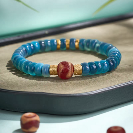Tibetan Buddhist handmade red mutton tiger fang blue bubble bracelet, unisex lucky charm for wealth, spiritual balance, and personal energy.