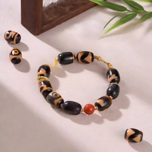 Tibetan Buddhist Jewelry Culture orange meat agate small bucket multi-totem Dzi bracelet. Handcrafted from natural agate as a piece of jewelry art.