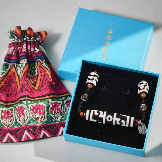 Purely handmade black and white Dzi beads necklace with ritual symbols, reflecting the heritage of Tibetan Buddhist Jewelry Culture jewelry art.