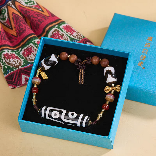 Purely handmade black and white six-eyed natural agate beads, reflecting the heritage of Tibetan Buddhist Jewelry Culture jewelry art.