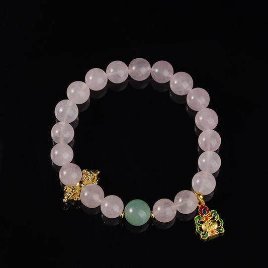 Blossom Glow rose quartz bracelet in Tibetan Buddhist jewelry art, featuring hand-painted designs for love energy and compassionate heart
