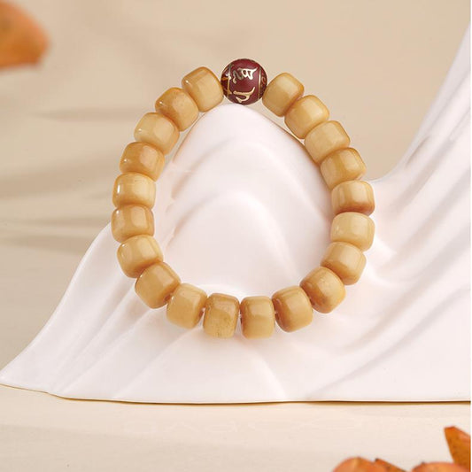 Hand-painted bone ash beads protection amulet in Tibetan Buddhist jewelry culture, crafted with sacred incense ashes and ritual symbols.