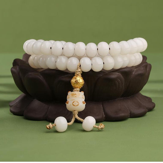 Serenity and purity emanate from this hand-painted white Bodhi bracelet, a fine example of Tibetan Buddhist jewelry art.