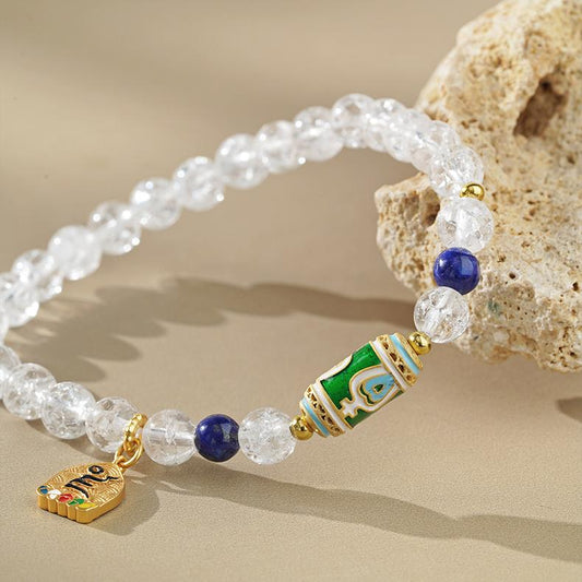 Main product image of Hand-Painted Clear Quartz and Lapis Bracelet. Features crystal clear quartz and deep blue lapis lazuli beads in harmonious combination, each bead adorned with artisan hand-painted Tibetan patterns, showcasing the purity and wisdom beauty of Tibetan Buddhist jewelry art.