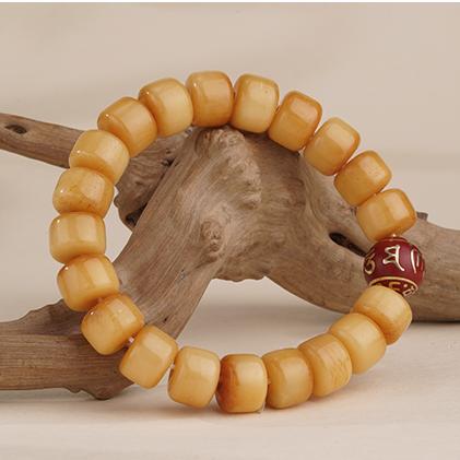 Tibetan Buddhist bone and incense ash beads bracelet featuring sacred symbols and traditional hand-painted artistry for spiritual protection.