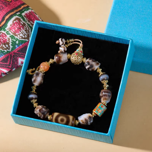 Tibetan Buddhist sacrificial implements culture Panda three-eyed Citipati Dzi bracelet. Handcrafted from natural agate as a piece of Buddhist sacrificial items art.