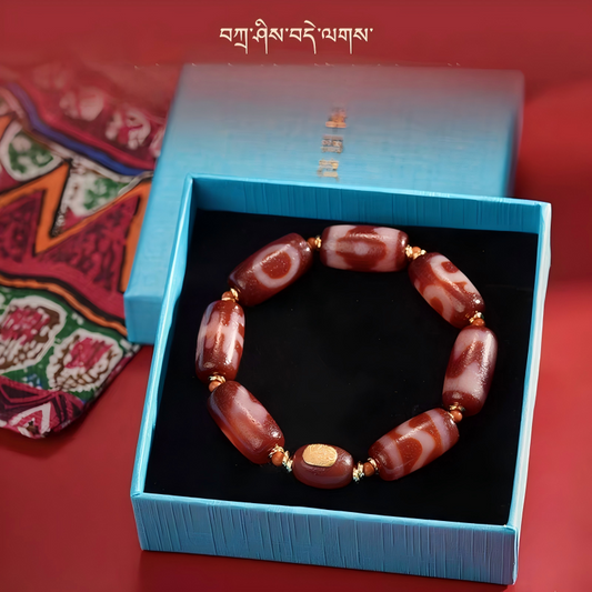 Authentic barrel-shaped red agate Dzi bead bracelet, showcasing Buddhist sacrificial items art and Tibetan Buddhist sacrificial implements culture. Purely handmade.