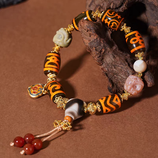 Tibetan Buddhist sacrificial implements culture Qingke barley-shaped multi-totem Dzi bead bracelet. Handcrafted from natural agate as a piece of Buddhist sacrificial items art.