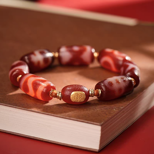 Tibetan Buddhist sacrificial implements culture red meat agate bucket-shaped multi-pattern Dzi bracelet. Handcrafted from natural agate as a piece of Buddhist sacrificial items art.