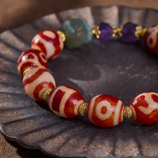 Exquisite red meat agate Dzi bead bracelet, a masterpiece of Buddhist sacrificial items art within the Tibetan Buddhist sacrificial implements culture. Purely handmade.