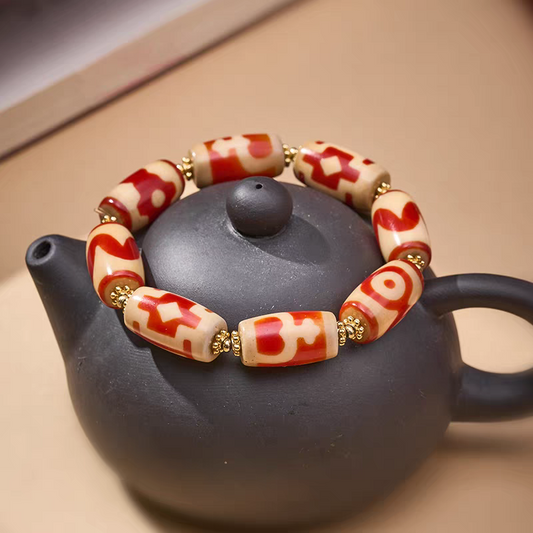 Tibetan Buddhist sacrificial implements culture small bucket red meat agate Dzi bracelet. Handcrafted from natural agate as a piece of Buddhist sacrificial items art.
