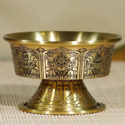 Tibetan Buddhist sacrificial implements culture: A set of offering bowls featuring the Eight Auspicious Symbols for daily water ritual offerings on sacred altars.