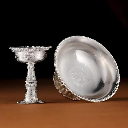 Exquisite sterling silver ritual cup, a masterpiece of Himalayan Buddhist sacrificial items art, showcasing traditional Tibetan Buddhist sacrificial implements culture.