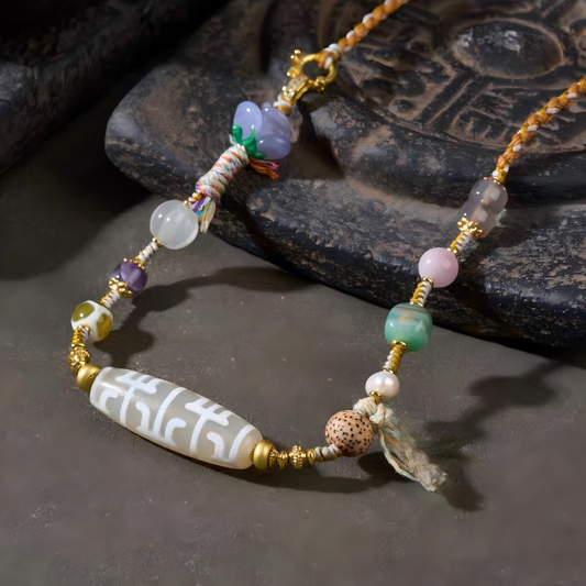 Tibetan Buddhist sacrificial implements culture natural agate clavicle necklace featuring a Lotus Guru Rinpoche Dzi bead. A sacred piece of Buddhist sacrificial items art.